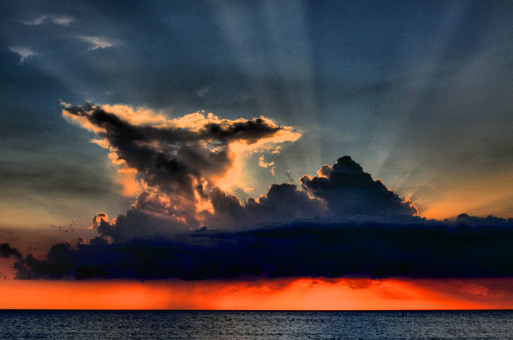 sun behind clouds
